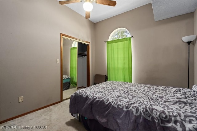 bedroom featuring a closet, carpet flooring, baseboards, and ceiling fan