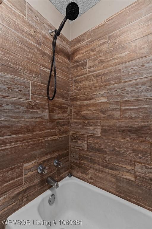 bathroom with shower / bath combination