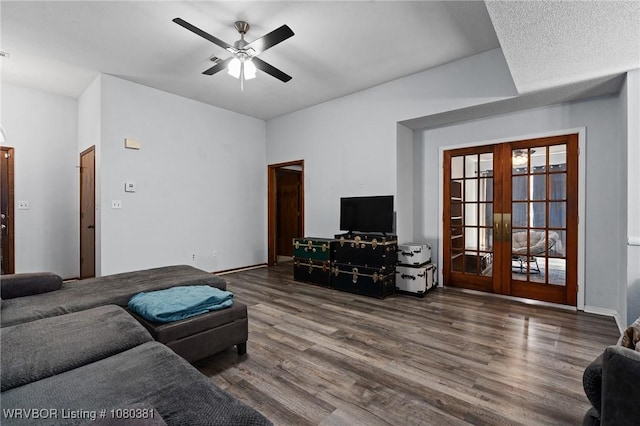 living area featuring ceiling fan, baseboards, french doors, and wood finished floors