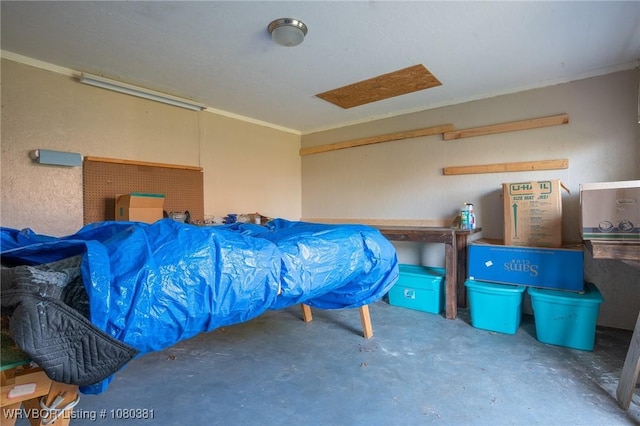 bedroom with unfinished concrete floors and crown molding