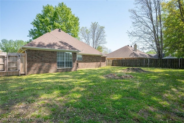 view of yard with a fenced backyard