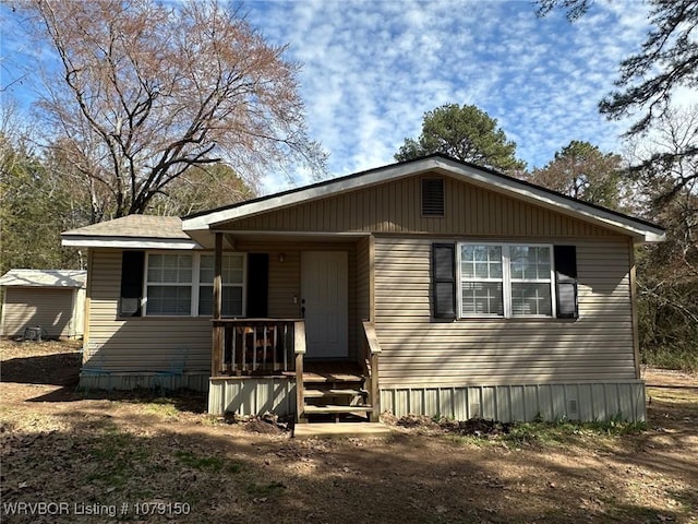 manufactured / mobile home featuring covered porch