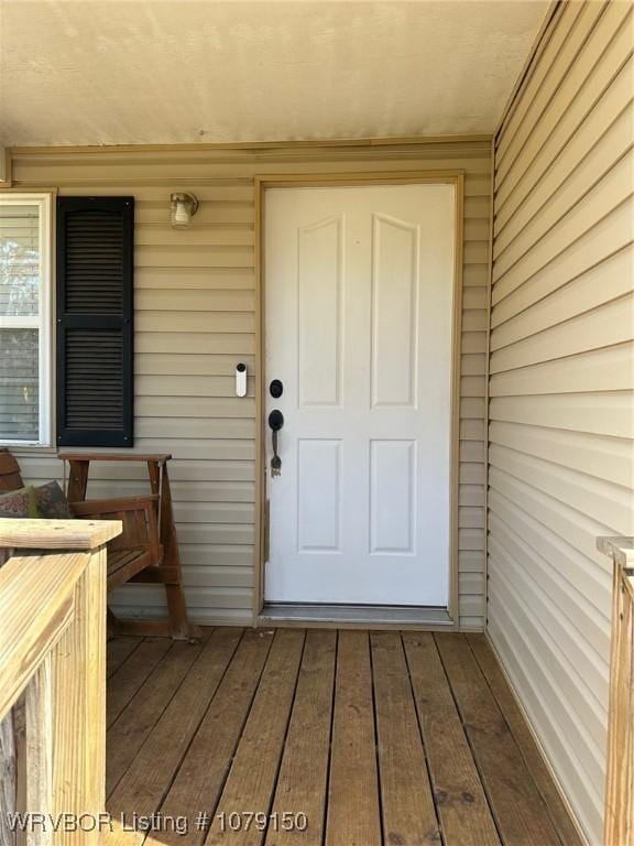 doorway to property featuring a standing seam roof