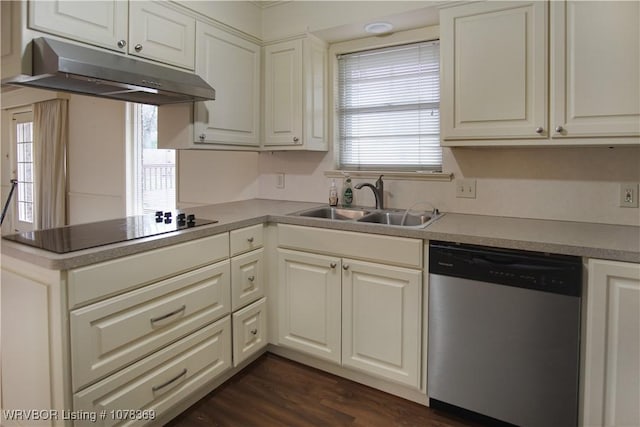 kitchen with stainless steel dishwasher, black electric cooktop, dark hardwood / wood-style flooring, white cabinets, and sink