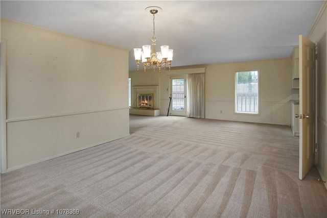 interior space featuring a notable chandelier and light carpet