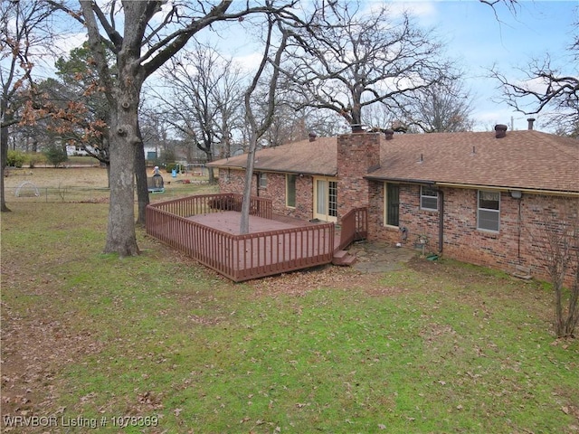 view of yard with a wooden deck