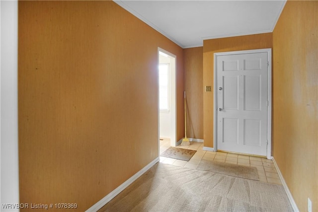 tiled entrance foyer with ornamental molding