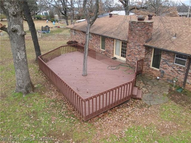 wooden terrace with a trampoline