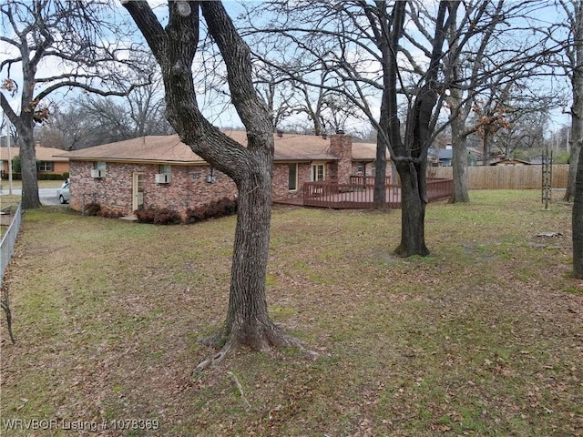 view of yard featuring a wooden deck