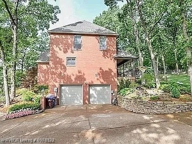 view of side of home with a garage