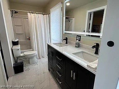 full bathroom with vanity, toilet, and shower / bathtub combination with curtain