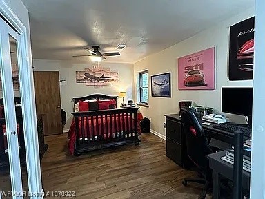 bedroom with hardwood / wood-style flooring