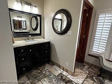 bathroom featuring vanity and a wealth of natural light