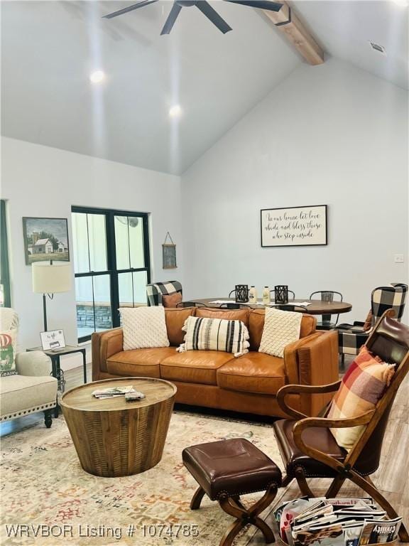 living room with beamed ceiling, ceiling fan, light hardwood / wood-style floors, and high vaulted ceiling