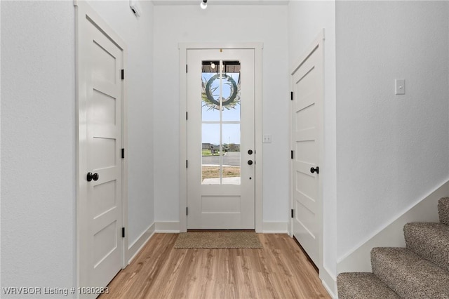 1900 Yellowstone Dr, Barling, AR 72923 - doorway with a wealth of natural light, stairway, light wood-type flooring, and baseboards