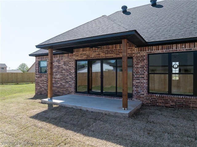 1900 Yellowstone Dr, Barling, AR 72923 - rear view of house featuring a patio area, brick siding, fence, and a shingled roof