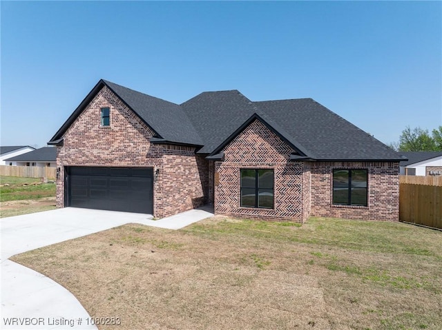 1900 Yellowstone Dr, Barling, AR 72923 - view of front of property featuring driveway, a front yard, fence, and brick siding