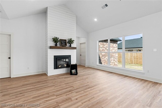 1900 Yellowstone Dr, Barling, AR 72923 - unfurnished living room featuring a fireplace, visible vents, light wood-type flooring, and baseboards