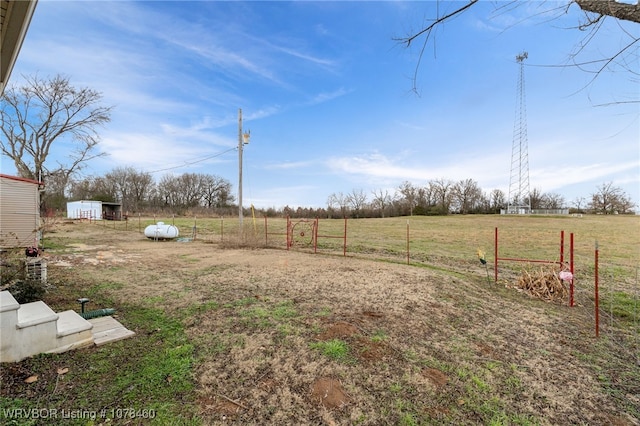 view of yard with a rural view