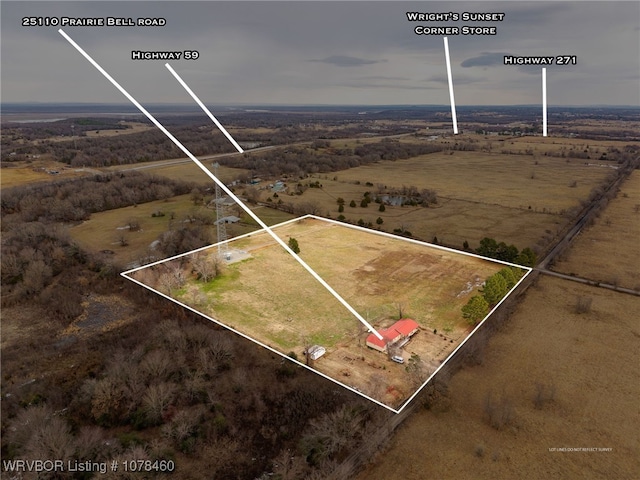 birds eye view of property with a rural view