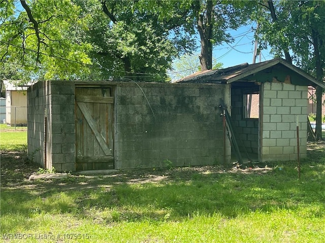 view of shed with fence