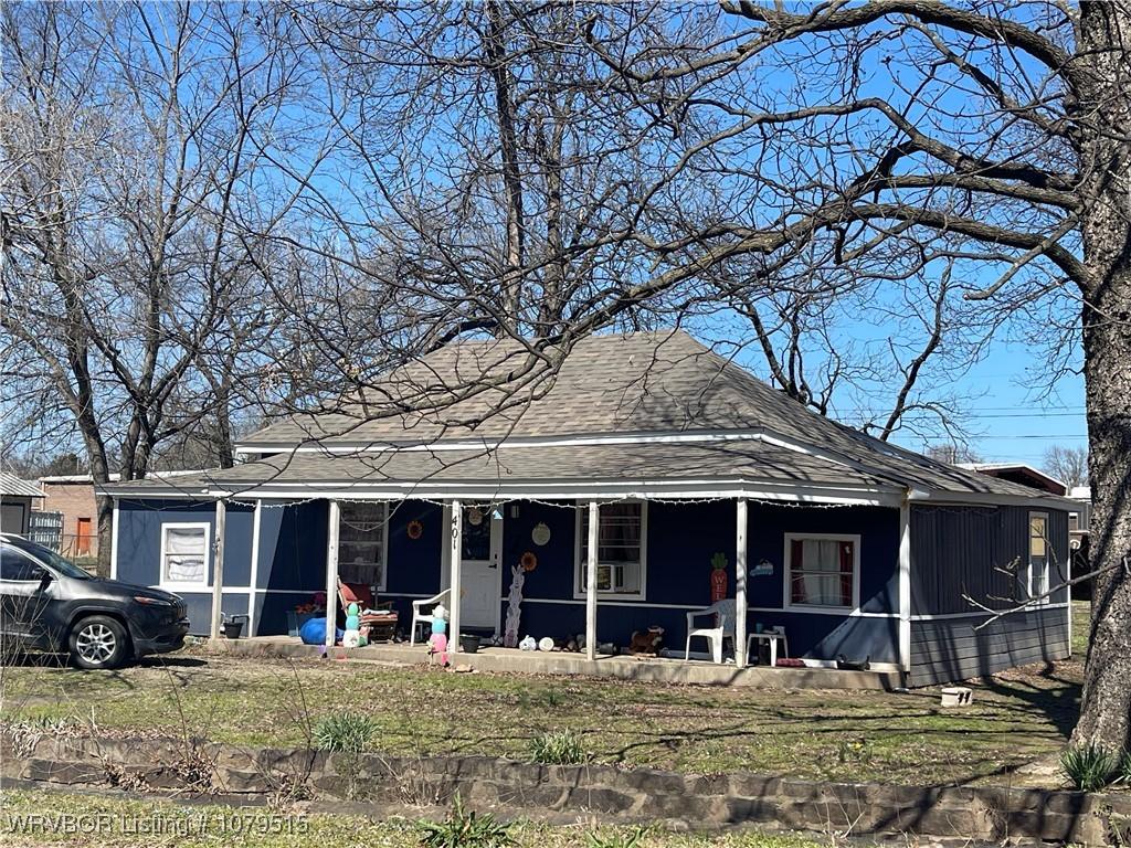 view of front of house featuring covered porch and roof with shingles