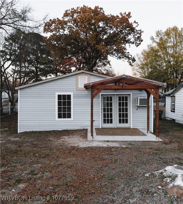 rear view of house featuring french doors