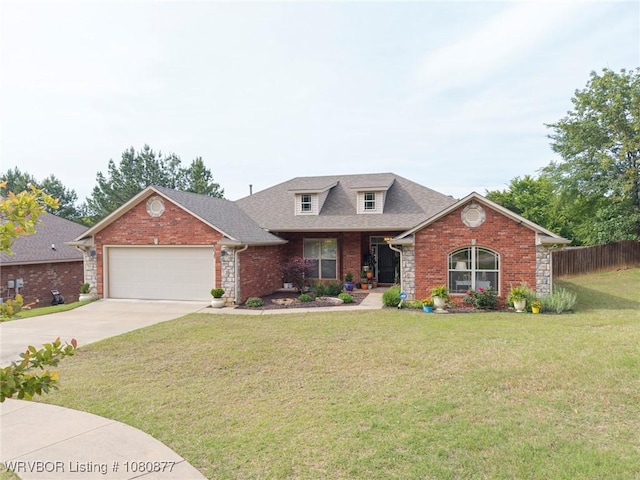 9019 Gracie Ln, Fort Smith, AR 72916 - view of front of property with an attached garage, concrete driveway, brick siding, and roof with shingles