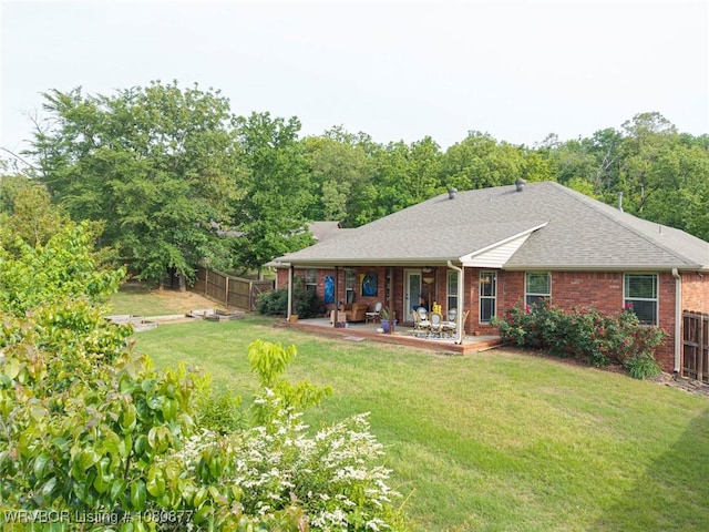9019 Gracie Ln, Fort Smith, AR 72916 - rear view of house featuring a shingled roof and brick siding