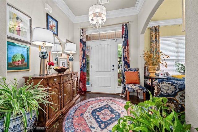 9019 Gracie Ln, Fort Smith, AR 72916 - foyer featuring wood finished floors, a chandelier, crown molding, arched walkways, and a textured wall