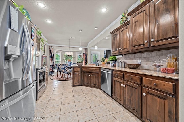 9019 Gracie Ln, Fort Smith, AR 72916 - kitchen with stainless steel appliances, ornamental molding, light tile patterned floors, a peninsula, and backsplash