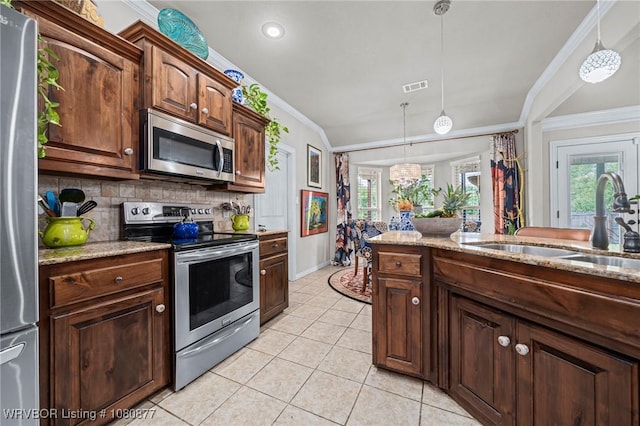 9019 Gracie Ln, Fort Smith, AR 72916 - kitchen featuring stainless steel appliances, ornamental molding, a sink, light tile patterned flooring, and light stone counters