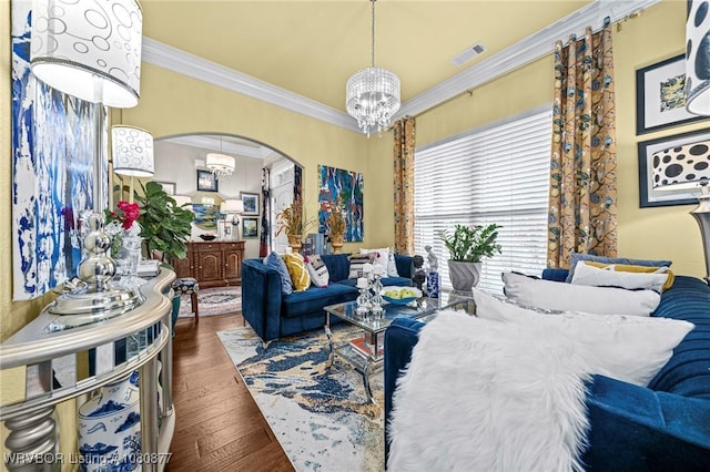 9019 Gracie Ln, Fort Smith, AR 72916 - living area featuring a chandelier, arched walkways, crown molding, and wood-type flooring