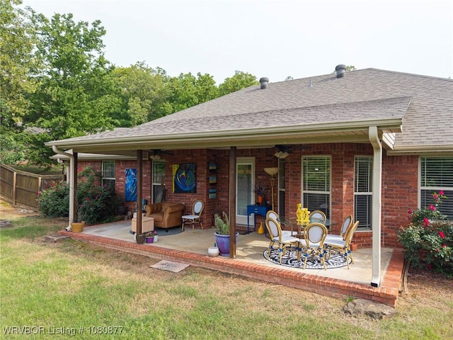 9019 Gracie Ln, Fort Smith, AR 72916 - back of property featuring a patio, a shingled roof, brick siding, and ceiling fan