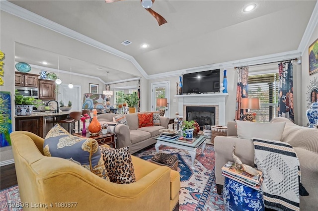 9019 Gracie Ln, Fort Smith, AR 72916 - living room featuring ornamental molding, a ceiling fan, a fireplace, vaulted ceiling, and recessed lighting