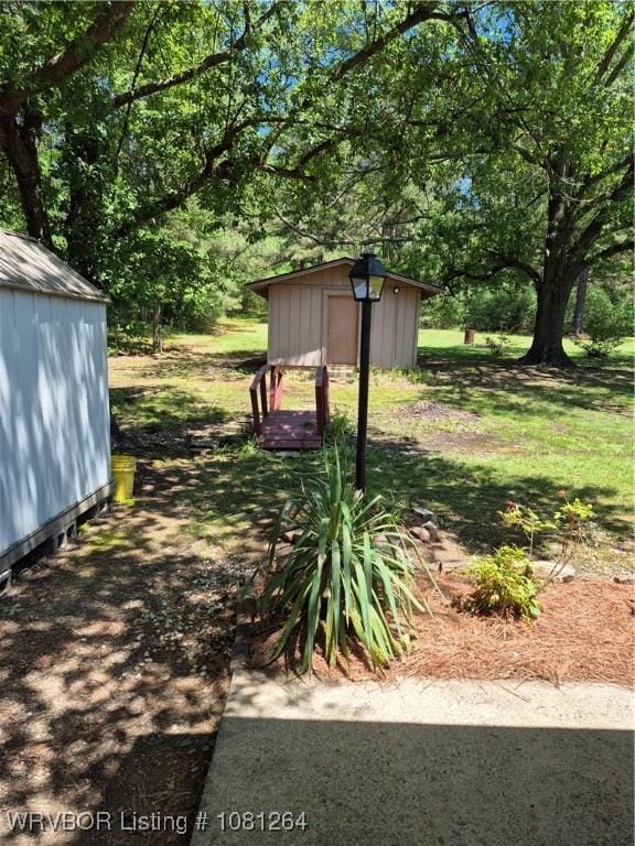1382 6th St, Waldron, AR 72958 - view of yard featuring view of wooded area
