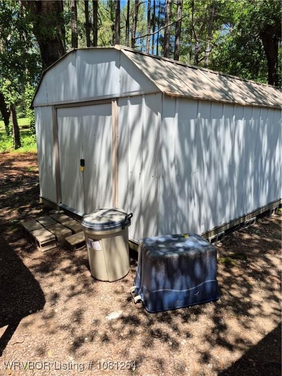 1382 6th St, Waldron, AR 72958 - view of shed with view of wooded area