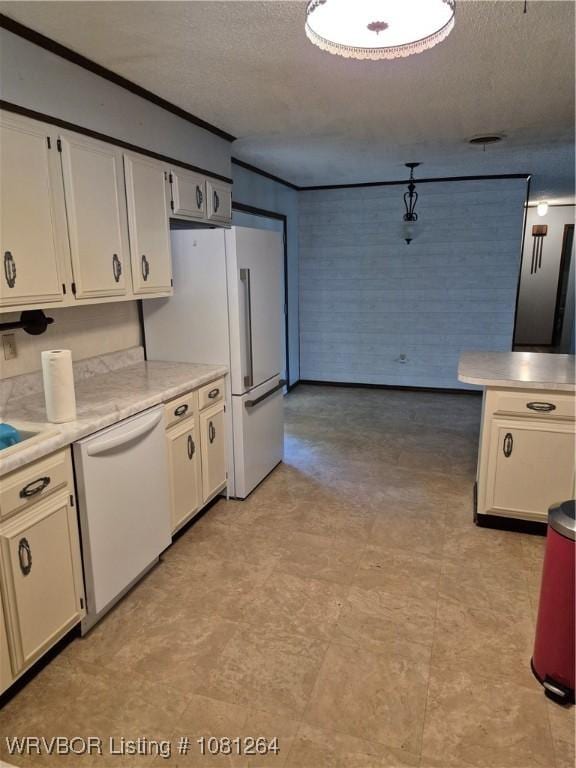 1382 6th St, Waldron, AR 72958 - kitchen with white appliances, a textured ceiling, light countertops, ornamental molding, and light flooring