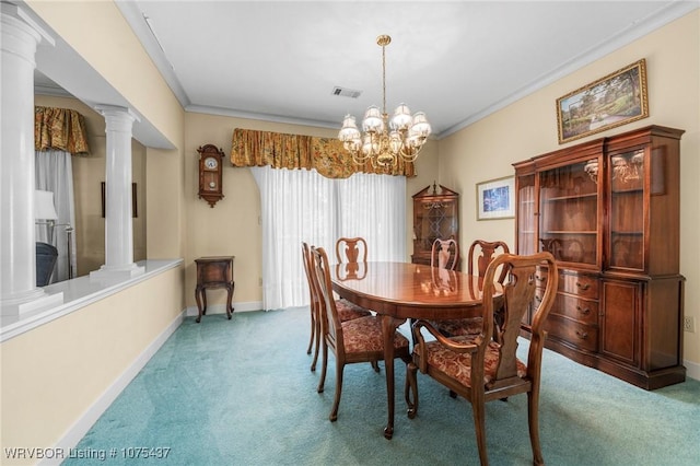 carpeted dining area featuring a chandelier, decorative columns, and ornamental molding