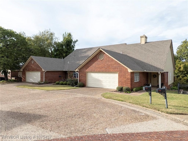 ranch-style home with a garage and a front yard