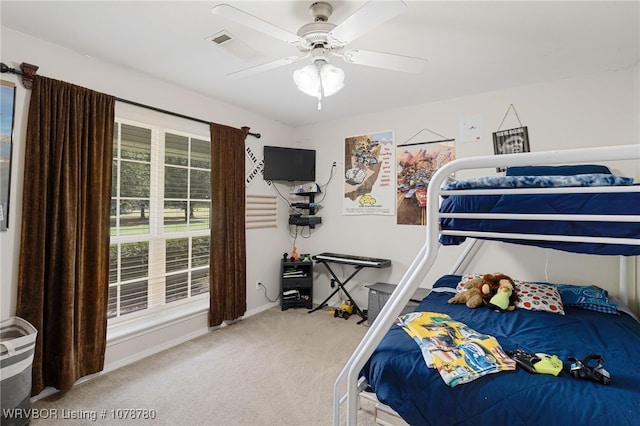 carpeted bedroom featuring ceiling fan