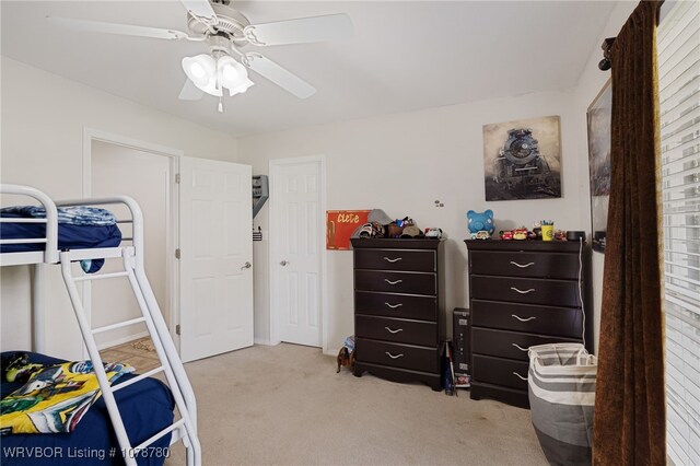 bedroom with light colored carpet and ceiling fan