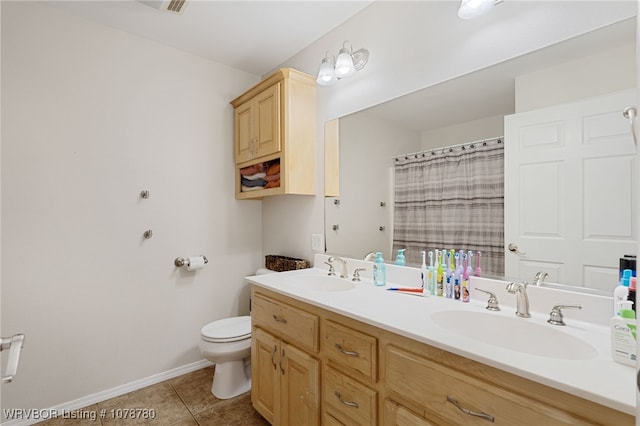 bathroom with walk in shower, tile patterned floors, toilet, and vanity