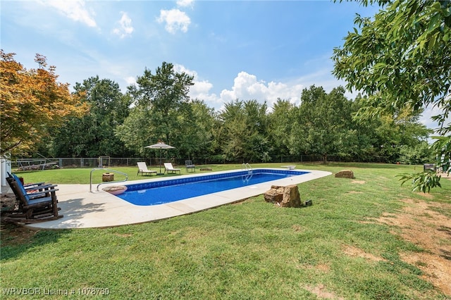 view of pool featuring a yard and a patio area