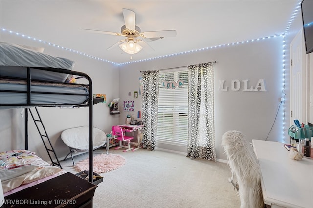 carpeted bedroom featuring ceiling fan