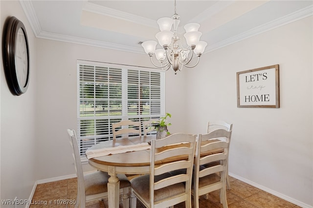 dining space with a raised ceiling, ornamental molding, light tile patterned floors, and a chandelier