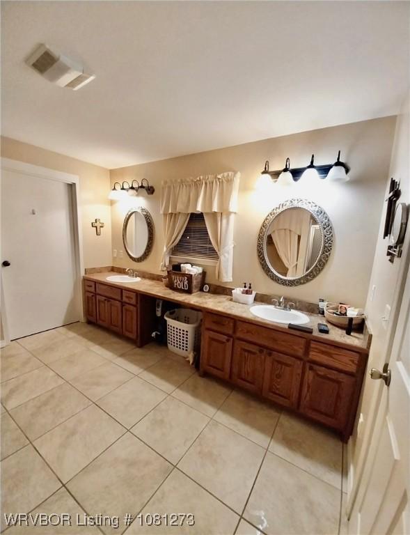195 Polk 492, Cove, AR 71937 - bathroom with double vanity and tile patterned floors