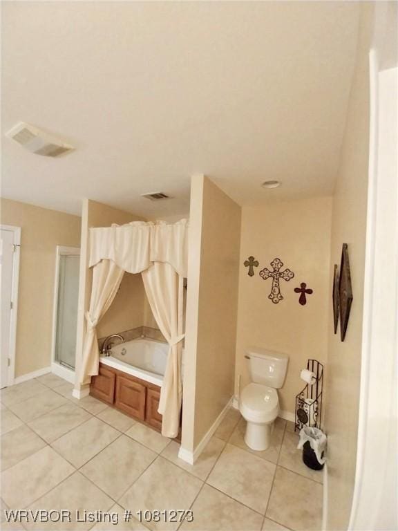195 Polk 492, Cove, AR 71937 - full bathroom with tile patterned flooring, a bath, toilet, and baseboards