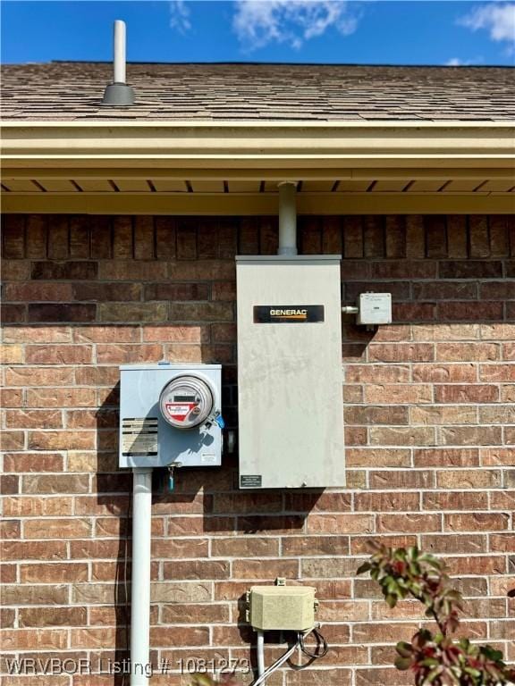 195 Polk 492, Cove, AR 71937 - exterior view of electric meter, brick siding, and roof with shingles
