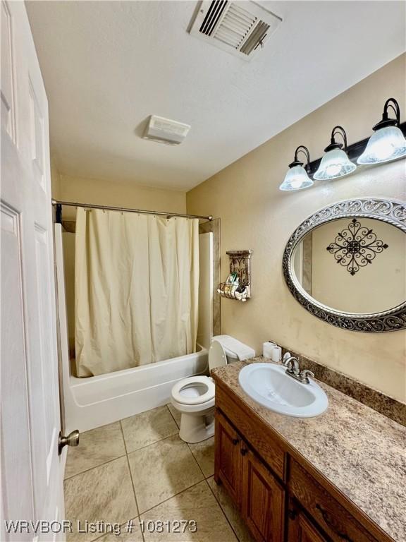 195 Polk 492, Cove, AR 71937 - bathroom with shower / bathtub combination with curtain, vanity, toilet, and tile patterned floors